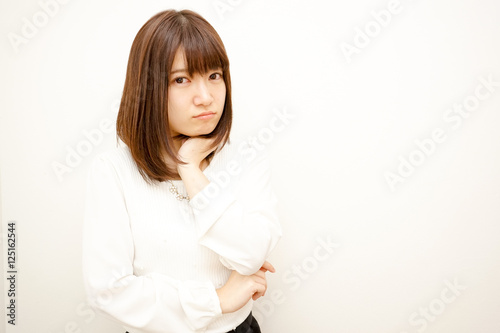 Young woman thinking something with white background © maroke
