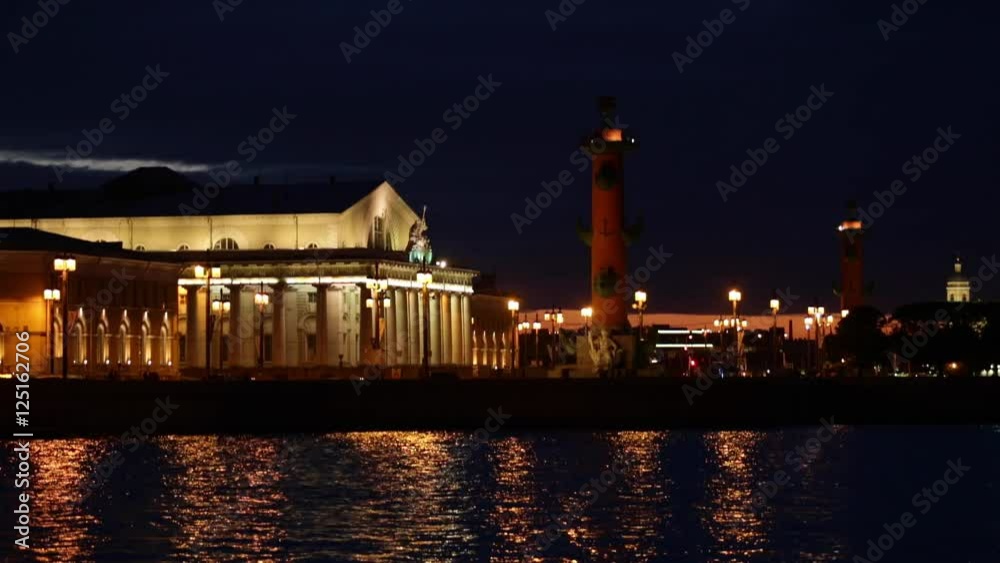 Russia, Saint-Petersburg, 28 March 2016: Night view of Old Stock Exchange Building and water area of Neva River at sunset, reflections, Birzhevoy, Dvorcovy, Palace bridge, Rastralnye columns Russia, Saint-Petersburg, 28 March 2016: Night view of Old Stock Exchange Building and water area of Neva River at sunset, reflections, Birzhevoy, Dvorcovy, Palace bridge, Rastralnye columns