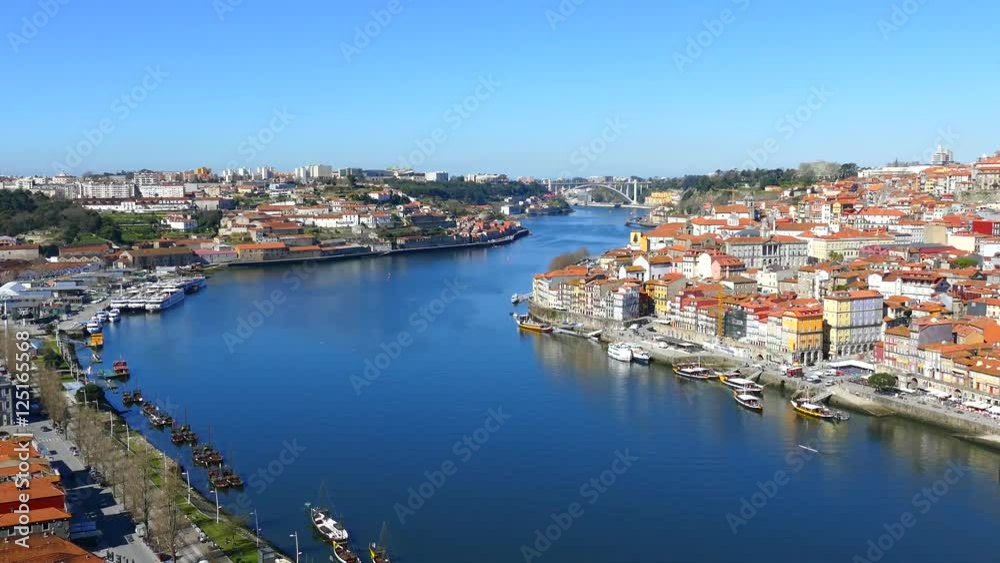 The Porto Metro Train crosses the Dom Luis 1 Bridge over the River Douro. The train is traveling from Vila Nova da Gaia to Porto city, across the River Douro. PORTO, PORTUGAL , MARCH 2015 .4K The Porto Metro Train crosses the Dom Luis 1 Bridge over the River Douro. The train is traveling from Vila Nova da Gaia to Porto city, across the River Douro. PORTO, PORTUGAL , MARCH 2015 .4K