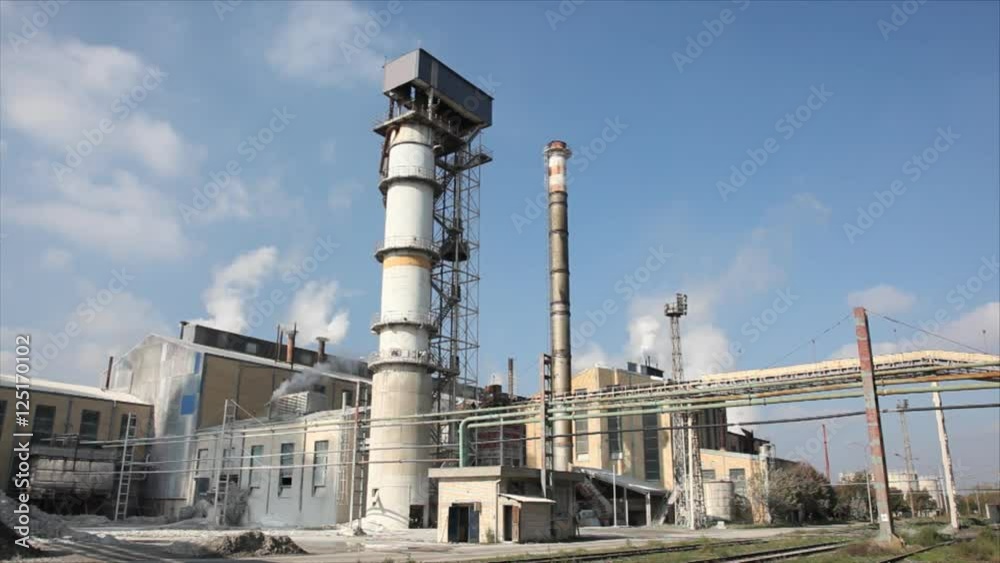 Processing Sugar Beet in Sugar Refinery.Industry exterior Pipeline, Smoke and Silo Processing Sugar Beet in Sugar Refinery.Industry exterior Pipeline, Smoke and Silo