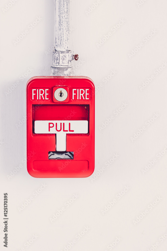 Old red box fire alarm  isolated on white background