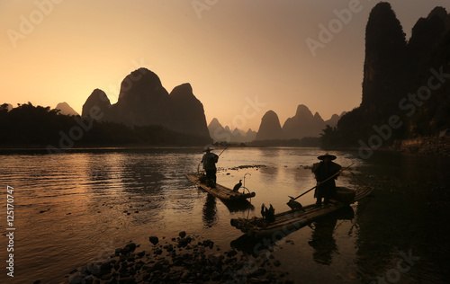 Photography Fisherman in boat - Li River, China