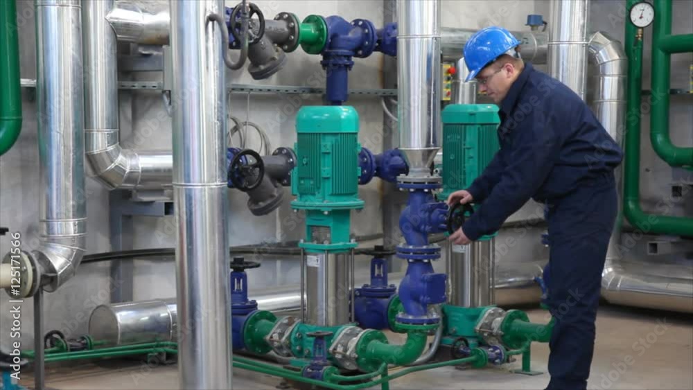 HD 1080: Man working in a factory, controls the operation of devices in a Heating Plant HD 1080: Man working in a factory, controls the operation of devices in a Heating Plant
