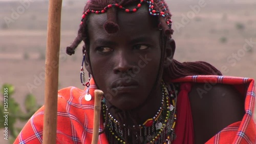 Portrait Masai Warrior dressed in his traditional clothing photo