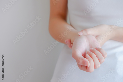 soft focus on hand of woman feel pain that are sign of Rheumatoi