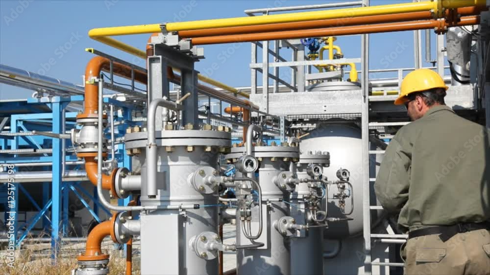 Underground storage of natural gas. Factory distribution, and industrial processing of natural gas with Worker. Many pipelines and construction.