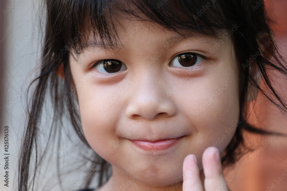 Cute girl asian face looking at the camera, she's happiness emotion Cute girl asian face looking at the camera, she's happiness emotion