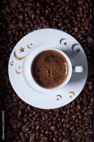 Turkish coffee on coffee beans background © Berna Şafoğlu