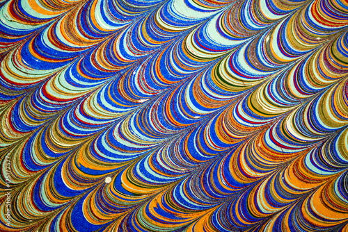Ebru art. Traditional Turkish Ebru technique. Painting on water, followed by paper prints. Color paint ebru with waves and tile pattern.