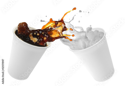 Paper cups with milk and coffee splashes on white background