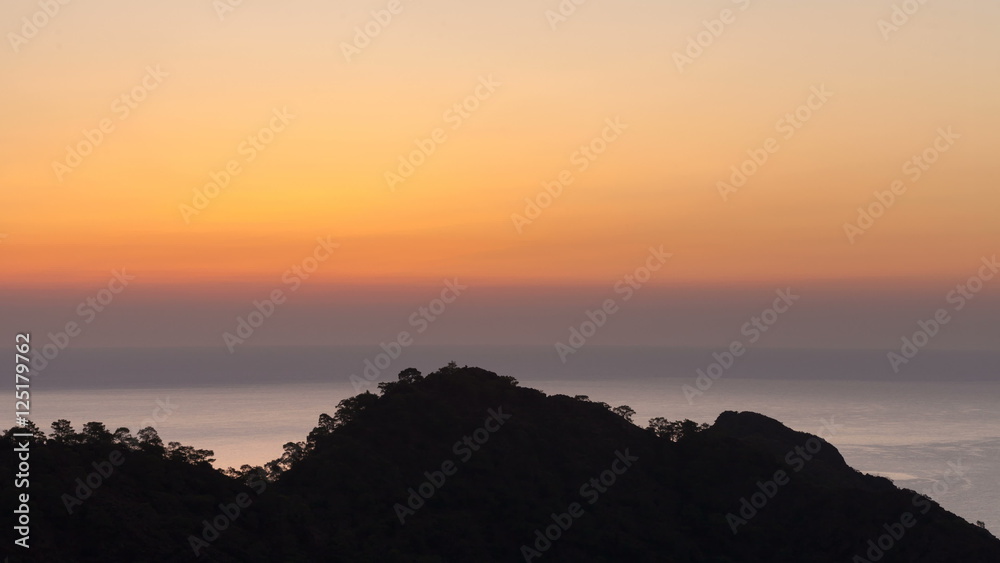 scenic sunrise background sun rising. timelapse of sun rising behing sea and mountains