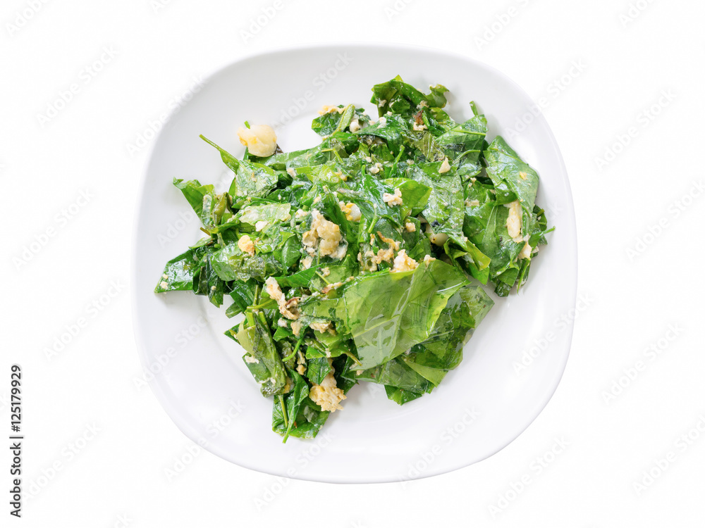 Stir fried Gnetum gnemon or Melinjo with egg in white plate isol Stir fried Gnetum gnemon or Melinjo with egg in white plate isol