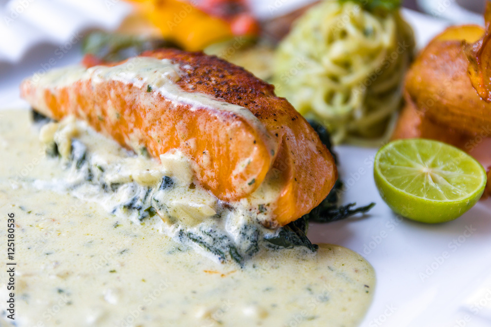 Grilled Salmon Fillet with Spinach and White Sauce Grilled Salmon Fillet with Spinach and White Sauce