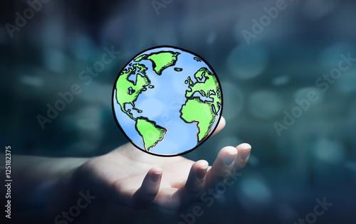 Fototapeta Naklejka Na Ścianę i Meble -  Businesswoman holding hand drawn planet earth