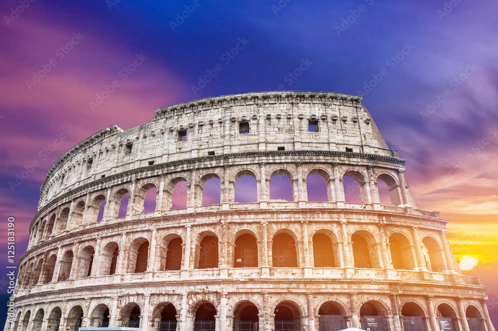 Colosseum in Rome, Italy on sunset background
