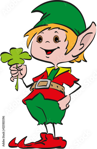 Happy smiling boy Christmas Santa's elf holding a four-leaf clover  in his hand 