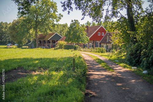 Rural road to old dutch house. Winterswijk. Achterhoek. Gelderland. photo