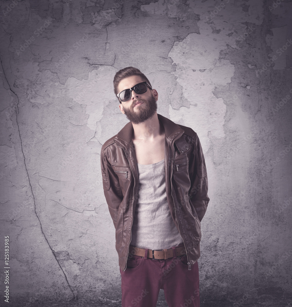 Handsome hipster in fashion clothing
