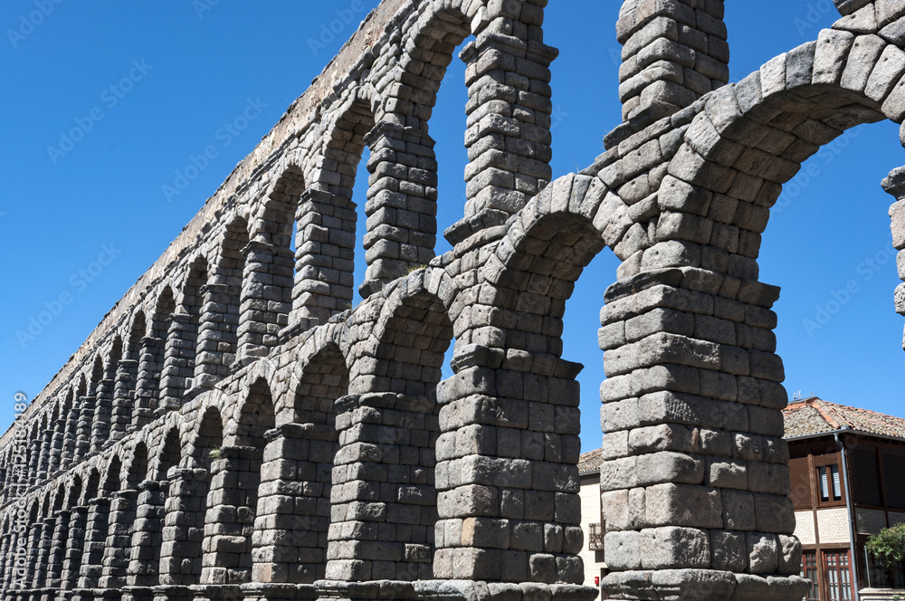 Views of the Aqueduct of Segovia, Spain. It is a roman aqueduct and the date of construction cannot be definitively determined Views of the Aqueduct of Segovia, Spain. It is a roman aqueduct and the date of construction cannot be definitively determined