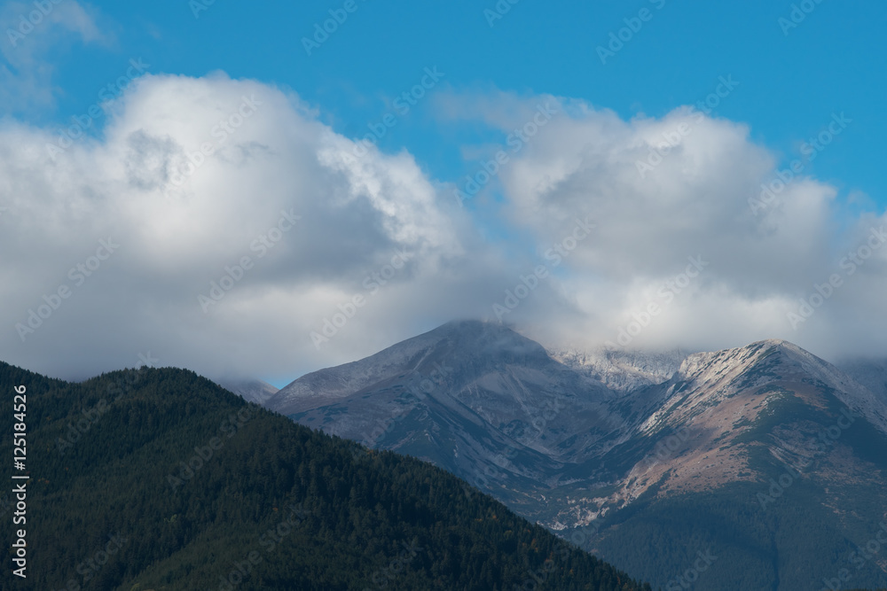 The beautiful mountain on the background of cloud stream. Wide angle