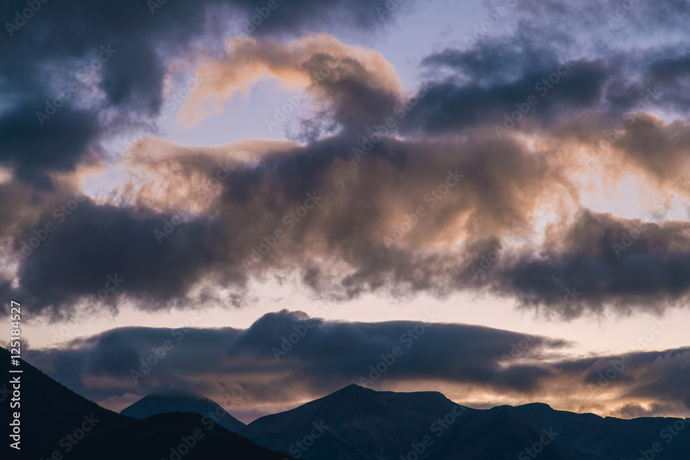 The beautiful cloud against the background of the mountain. Wide angle