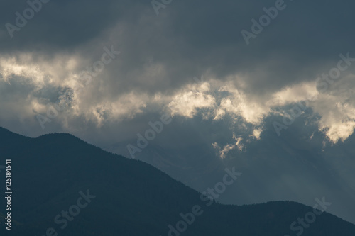 The mountain view on the background of cloud stream. Wide angle