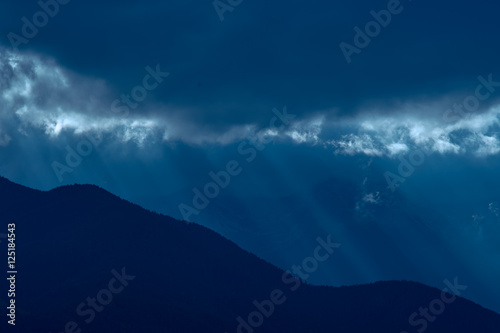 The picturesque mountain view on the background of moonlight. Wide angle