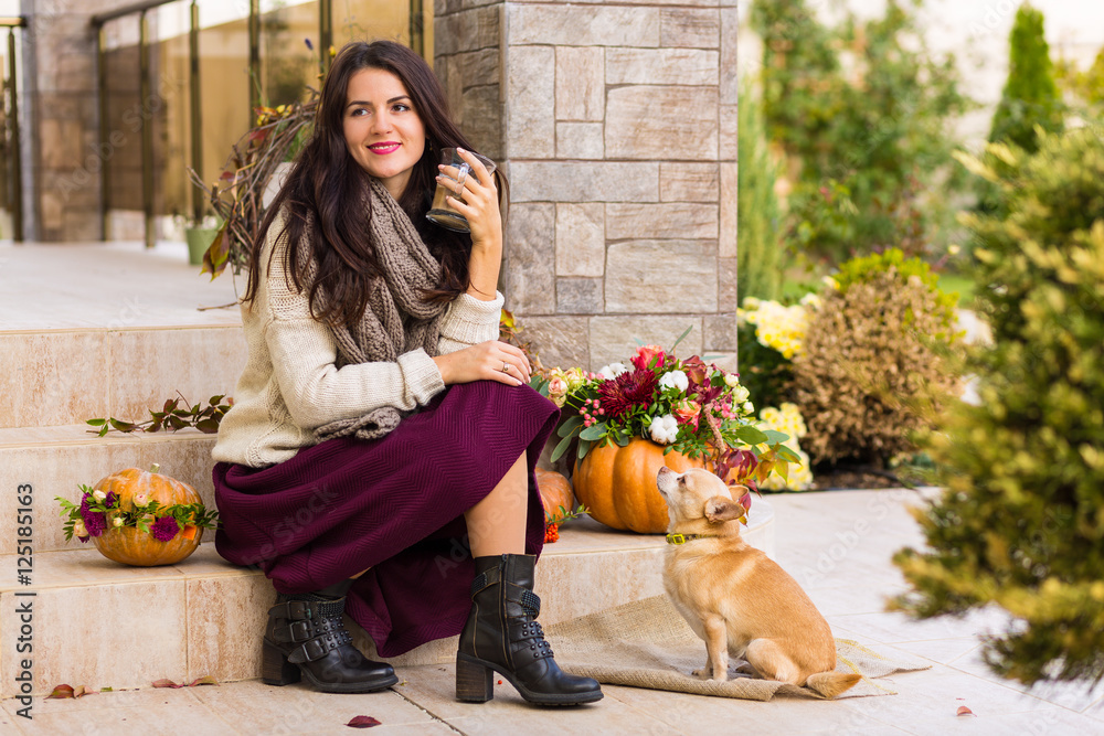 Pretty woman sitting on a decorated porch Stock 写真 | Adobe Stock