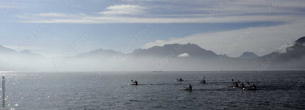 Kayakers on kayak and canoe doing the race on Annecy lake
