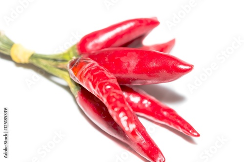 Red hot chili peppers tied isolated on white background