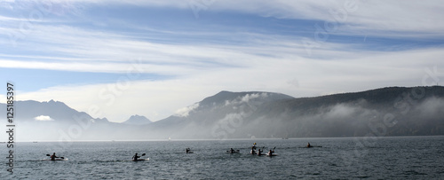 Kayakers on kayak and canoe doing the race on Annecy lake photo