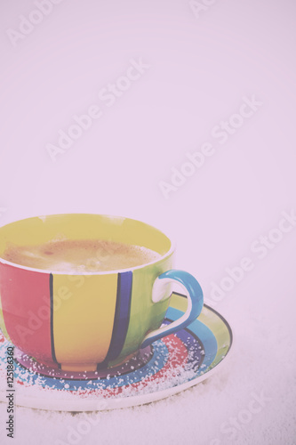 Hot chocolate in a bright colourful cup Vintage Retro Filter.