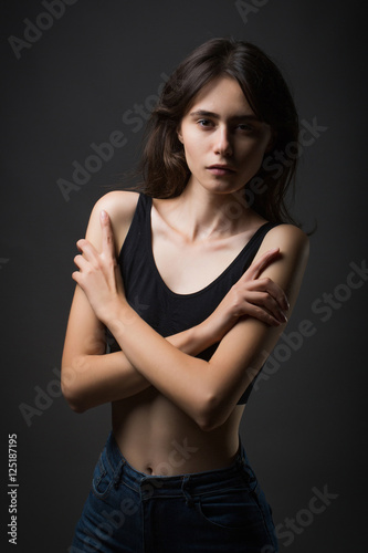 fashionable woman on dark grey