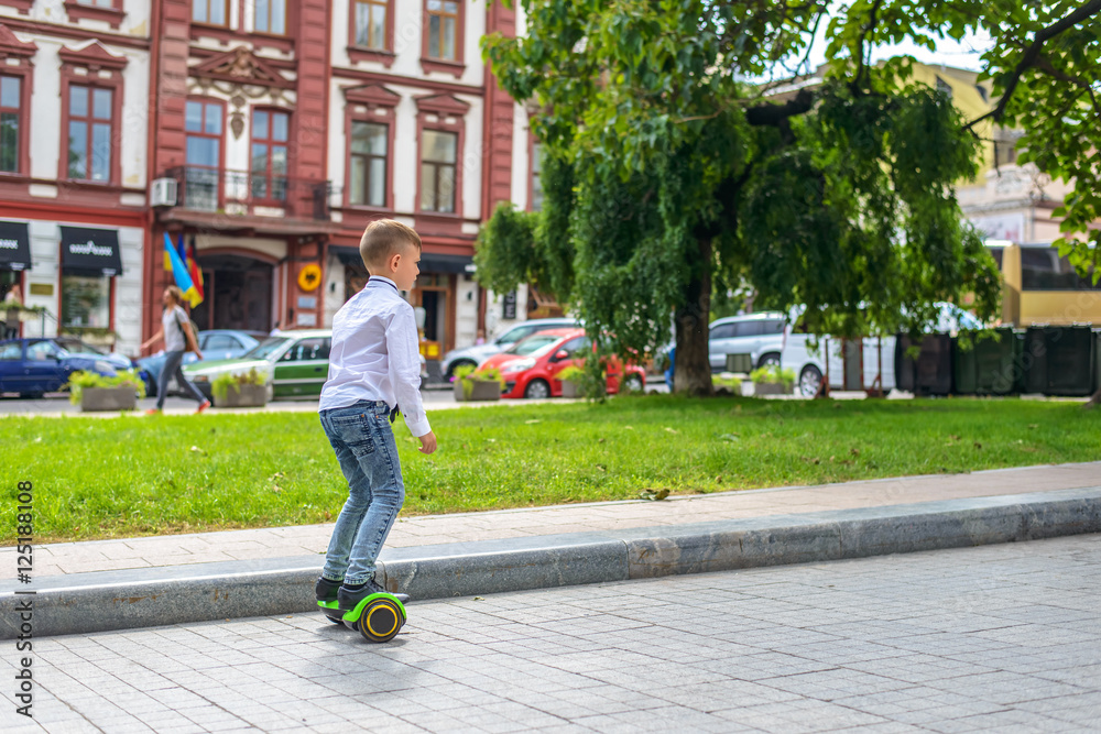 Stylish young boy riding a hover board Stylish young boy riding a hover board