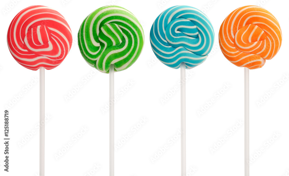 Red, green, blue and orange mini lollipops isolated on white. White swirls and white sticks. Red, green, blue and orange mini lollipops isolated on white. White swirls and white sticks.