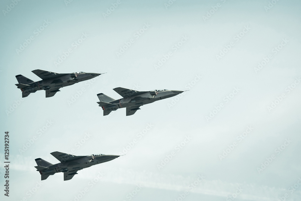 Fighter jets on blue sky background
Fighter jets on blue sky background