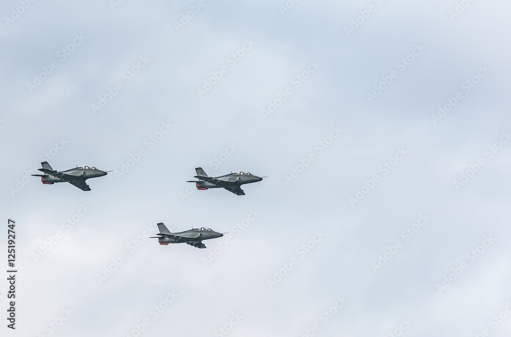 Fihter jets on cloudy sky background Fihter jets on cloudy sky background