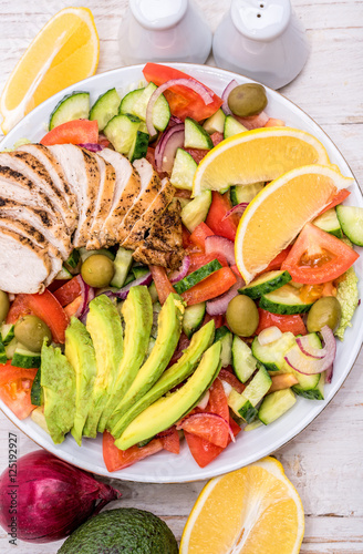 Mediterranean chicken salad with avocado . Concept of cooking.