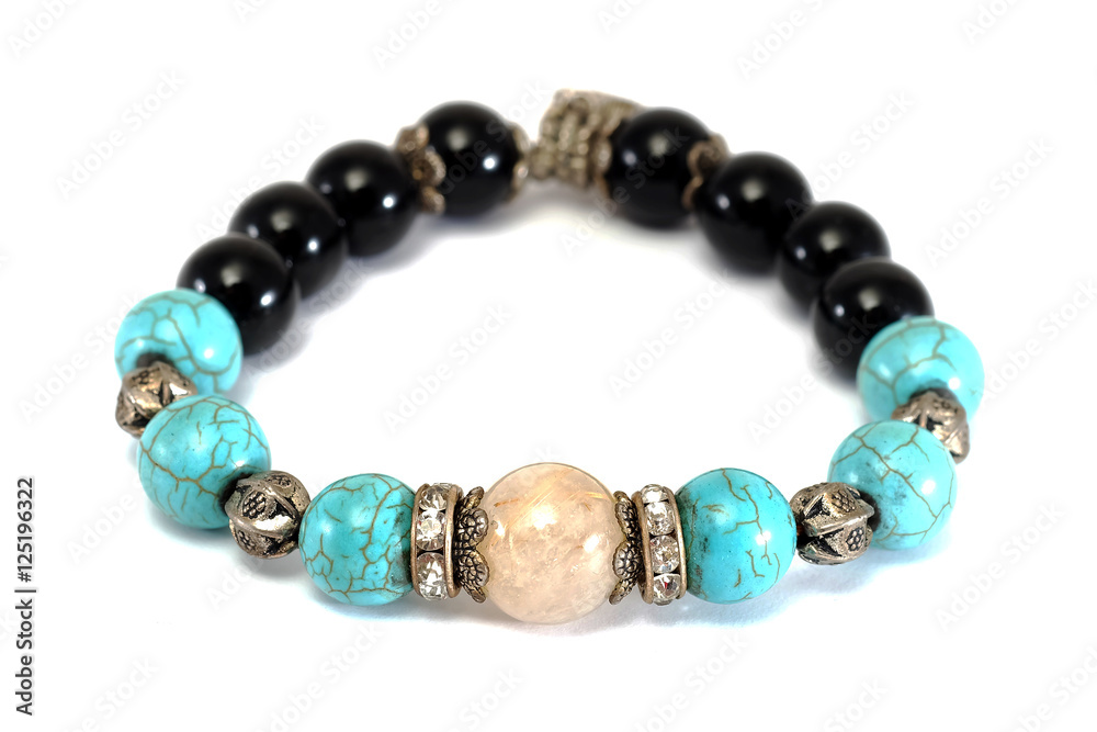Obraz premium Rutile Quartz,Turquoise, Black Spinel Lucky stone bracelet with withe isolated background