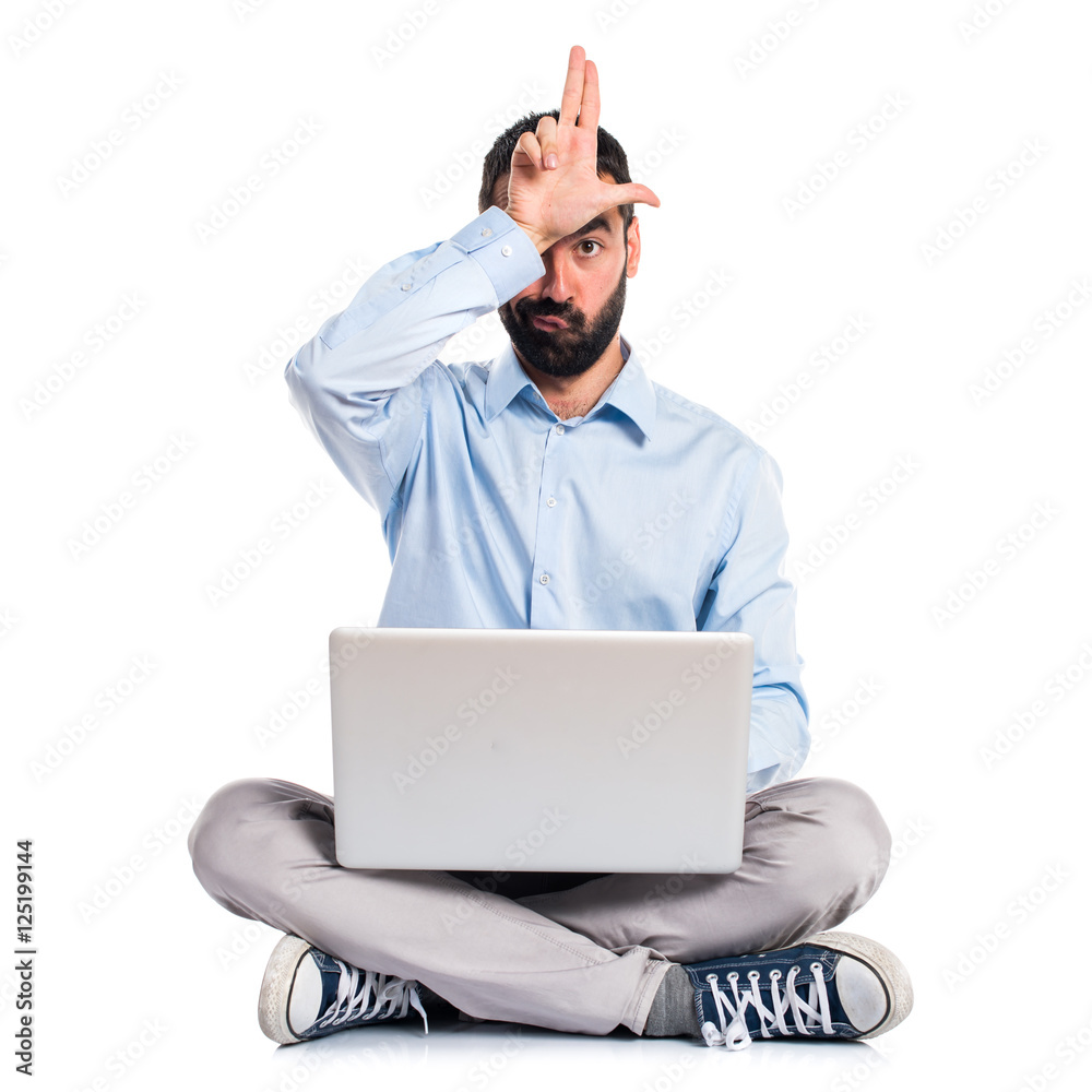 Man with laptop doing stupid sign Man with laptop doing stupid sign