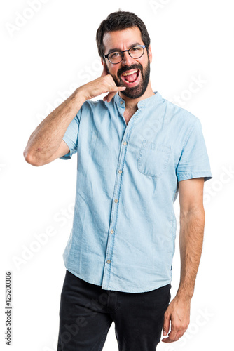 Handsome man making phone gesture