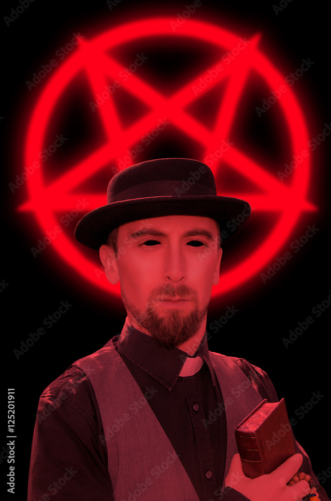 Satanic priest with book on red pentagram background