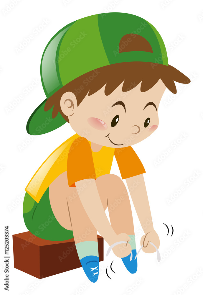 Boy tiding his shoelaces Boy tiding his shoelaces