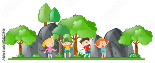 Children doing hulahoop in the park