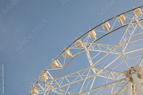 Ferris wheel on blue sky © yooranpark