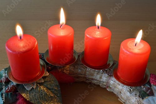 Advent wreath with four burning candles