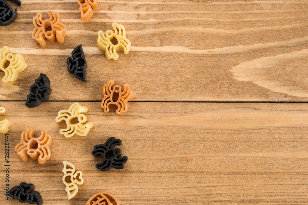 Halloween pasta on wooden table background
