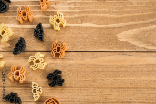 Halloween pasta on wooden table background