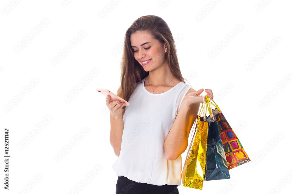 Woman with smartphone and shopping bags Woman with smartphone and shopping bags