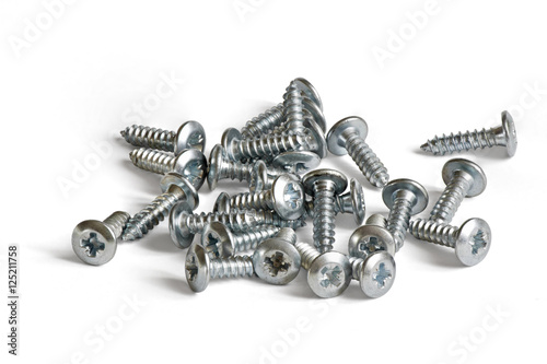a small pile of screws on white background